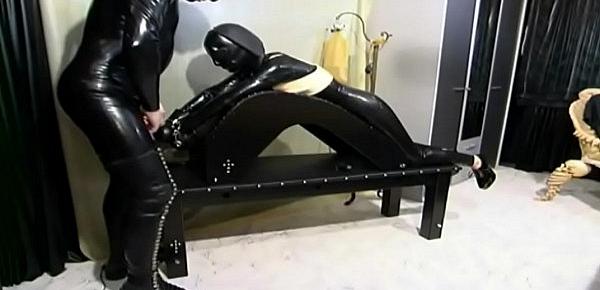  Woman in latex tied up and forced to suck a cock